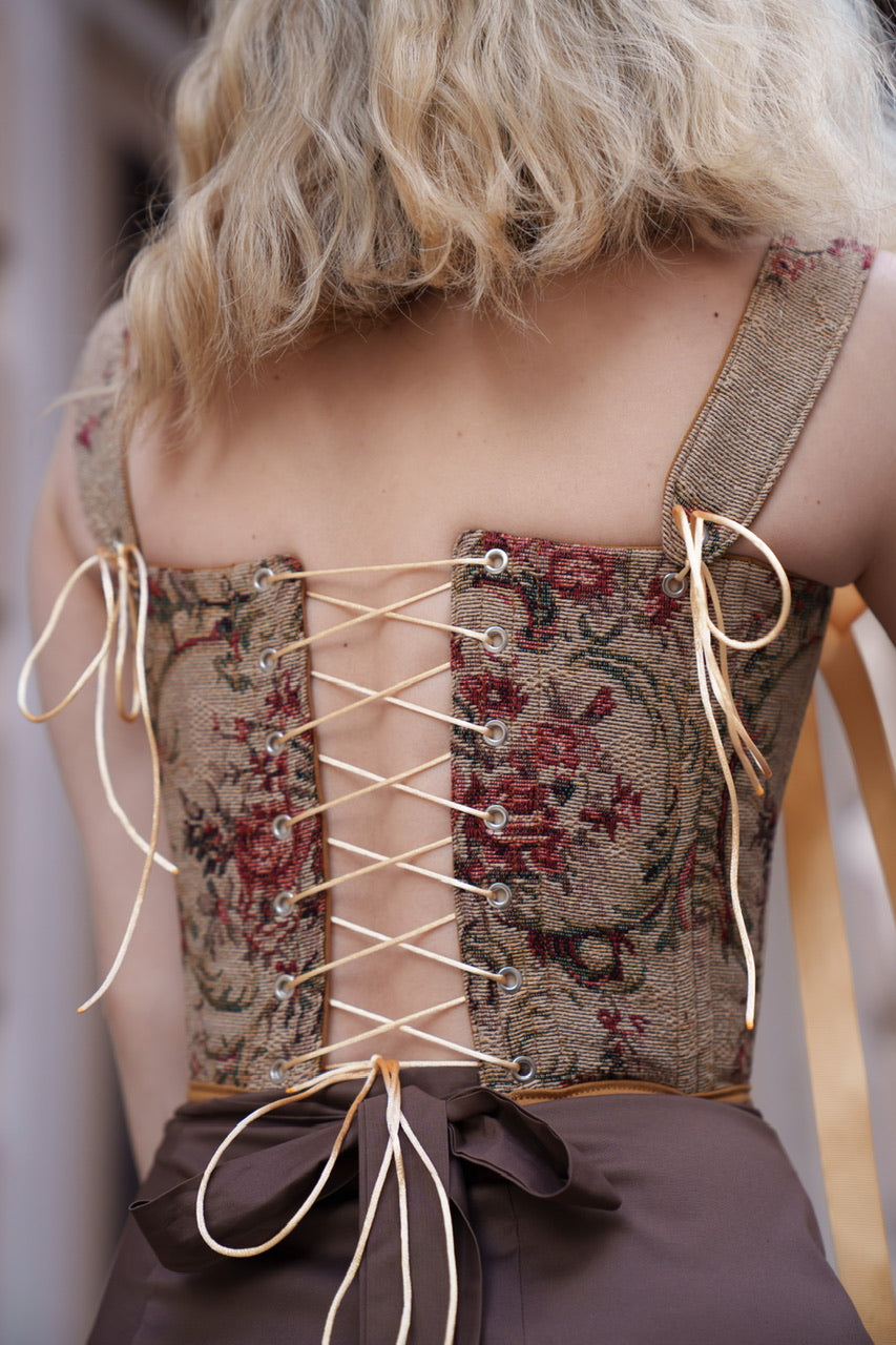 cognac floral corset top reversible, lace up corset front and back, tapestry corset with cognac flowers pattern, cognac denim reversible corset top, structured overbust corset for waist shaping, adjustable corset top custom size, warm tone corset outfit aesthetic, feminine silhouette shaping corset, two sided corset cognac fabric, ditogs corsets cognac flowers design