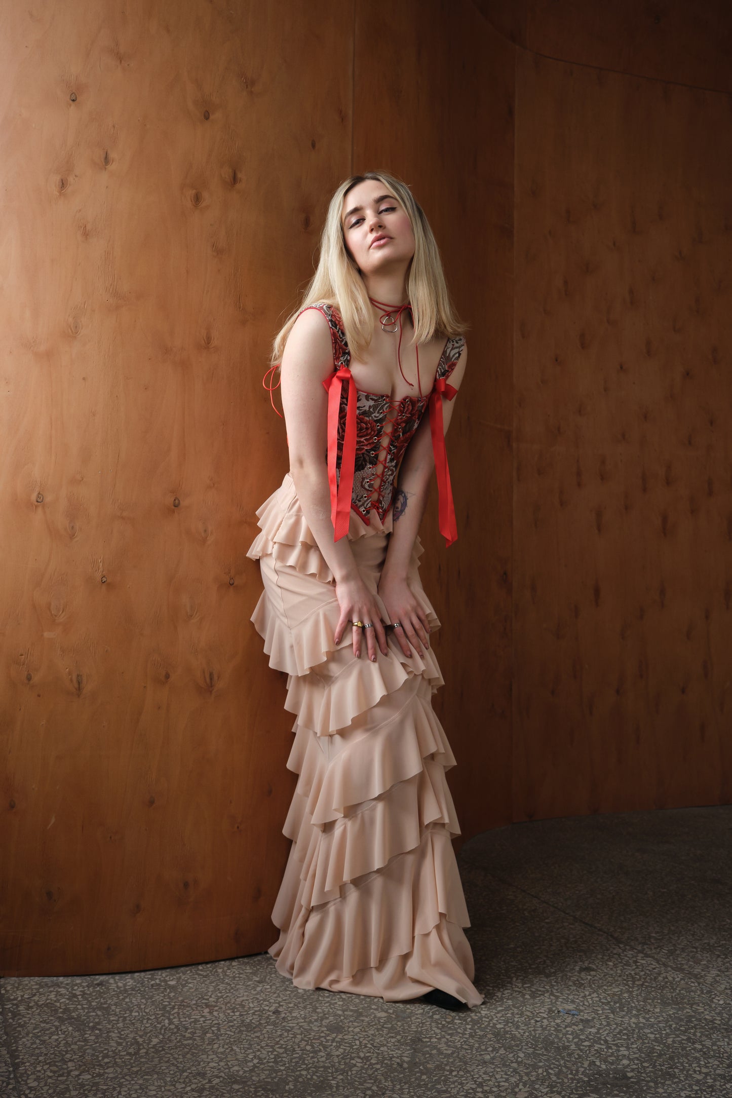 Reversible red floral corset top with lace-up front and back, structured boned bustier with jacquard fabric and adjustable fit, available with red or beige back panel