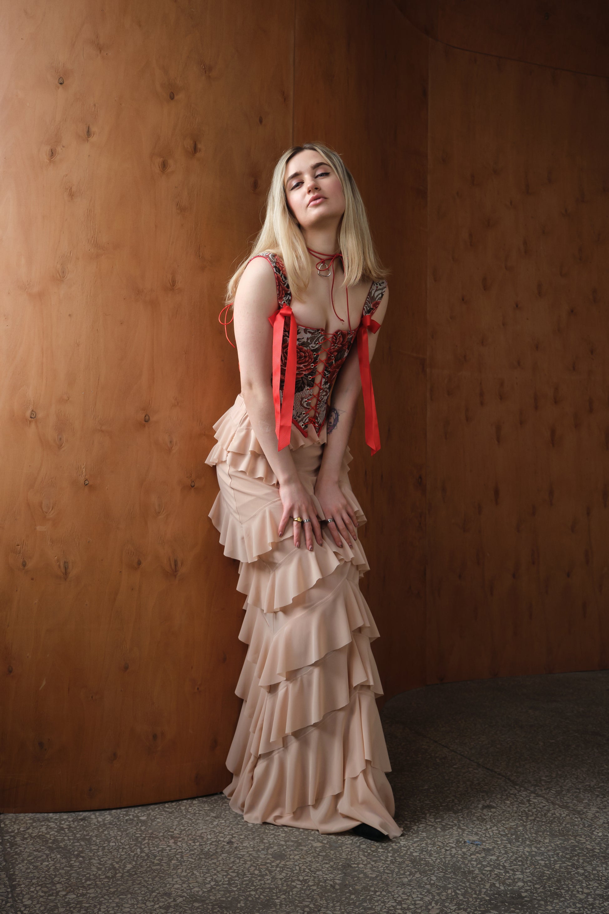 Reversible red floral corset top with lace-up front and back, structured boned bustier with jacquard fabric and adjustable fit, available with red or beige back panel