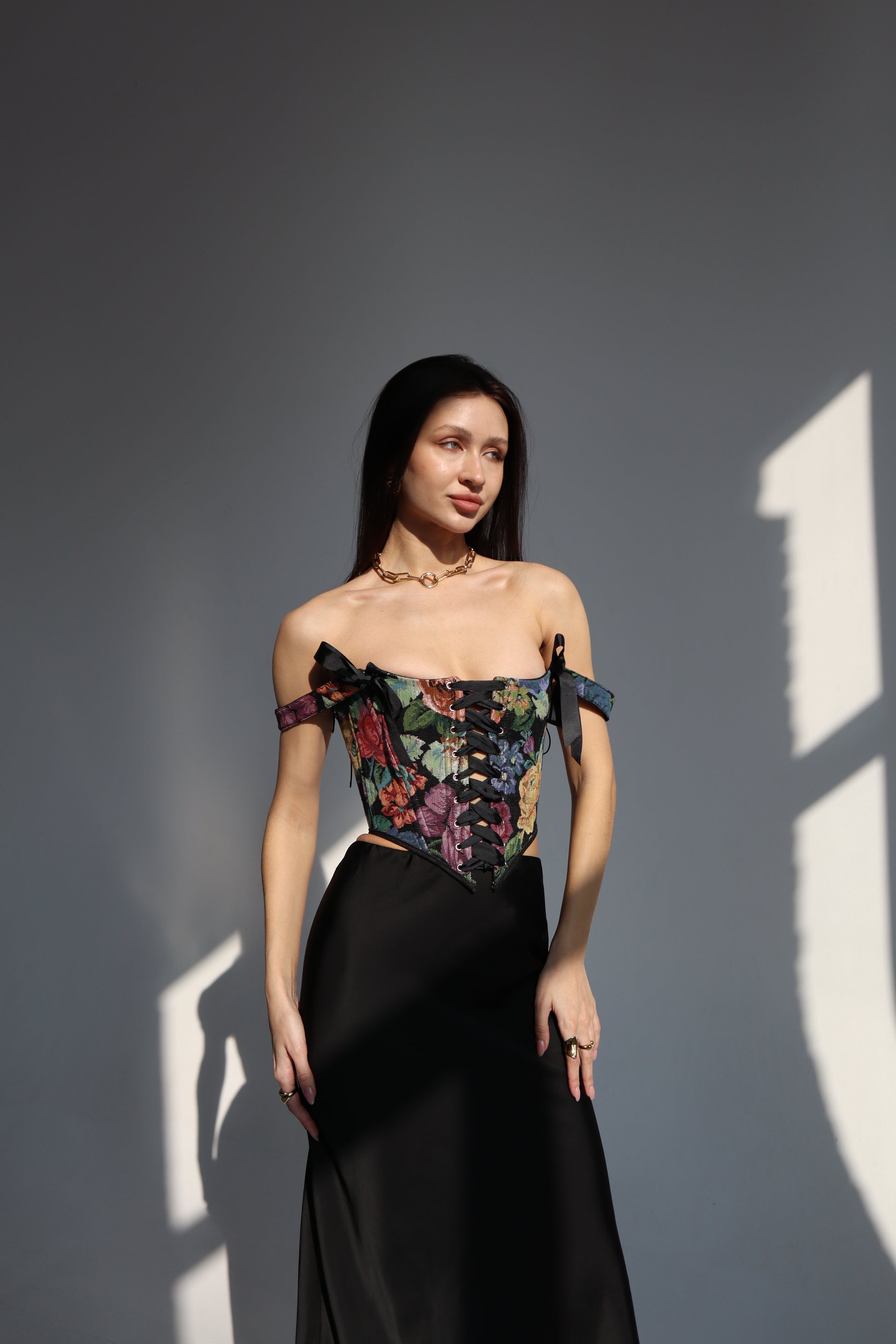 black floral corset top overbust, lace up corset front and back, tapestry corset with black flowers pattern, structured corset top for waist shaping, gothic romantic corset outfit, adjustable lace up corset top, custom size corset for perfect fit, elegant black corset with floral fabric texture, feminine silhouette shaping corset, ditogs corsets black flowers design
