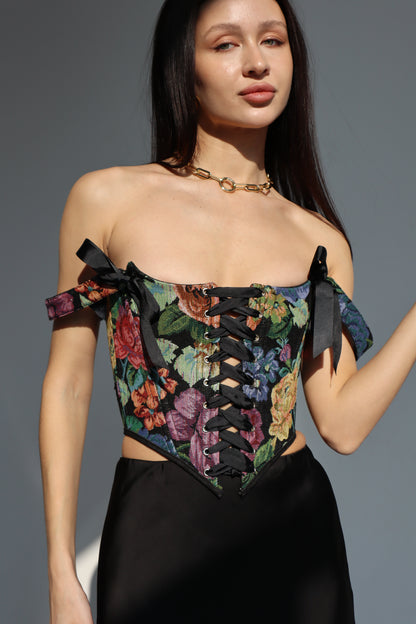 black floral corset top overbust, lace up corset front and back, tapestry corset with black flowers pattern, structured corset top for waist shaping, gothic romantic corset outfit, adjustable lace up corset top, custom size corset for perfect fit, elegant black corset with floral fabric texture, feminine silhouette shaping corset, ditogs corsets black flowers design
