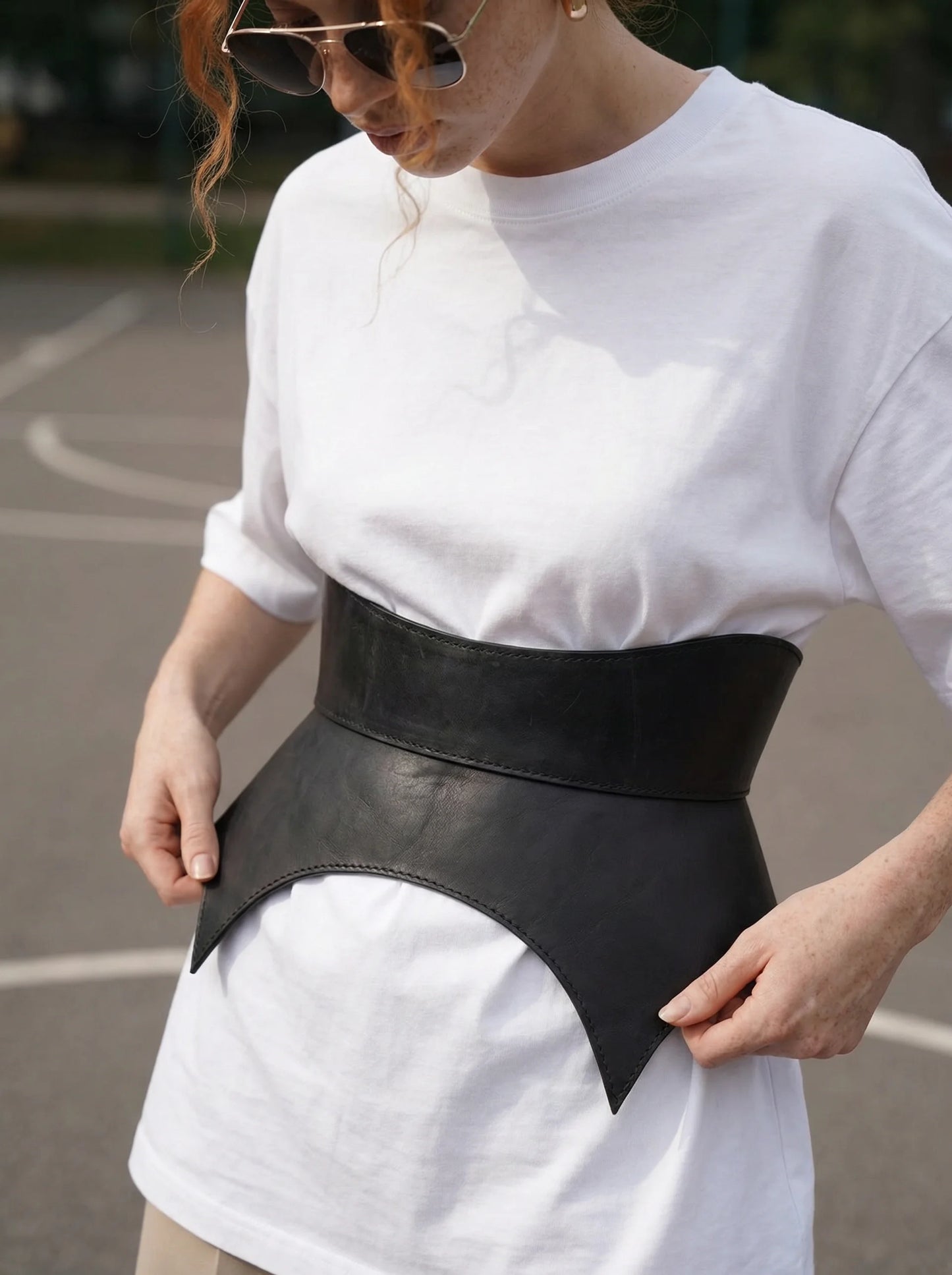 black leather basque belt cutout peplum waist belt structured waist belt sculpted leather belt statement outfit styling modern fashion waist belt