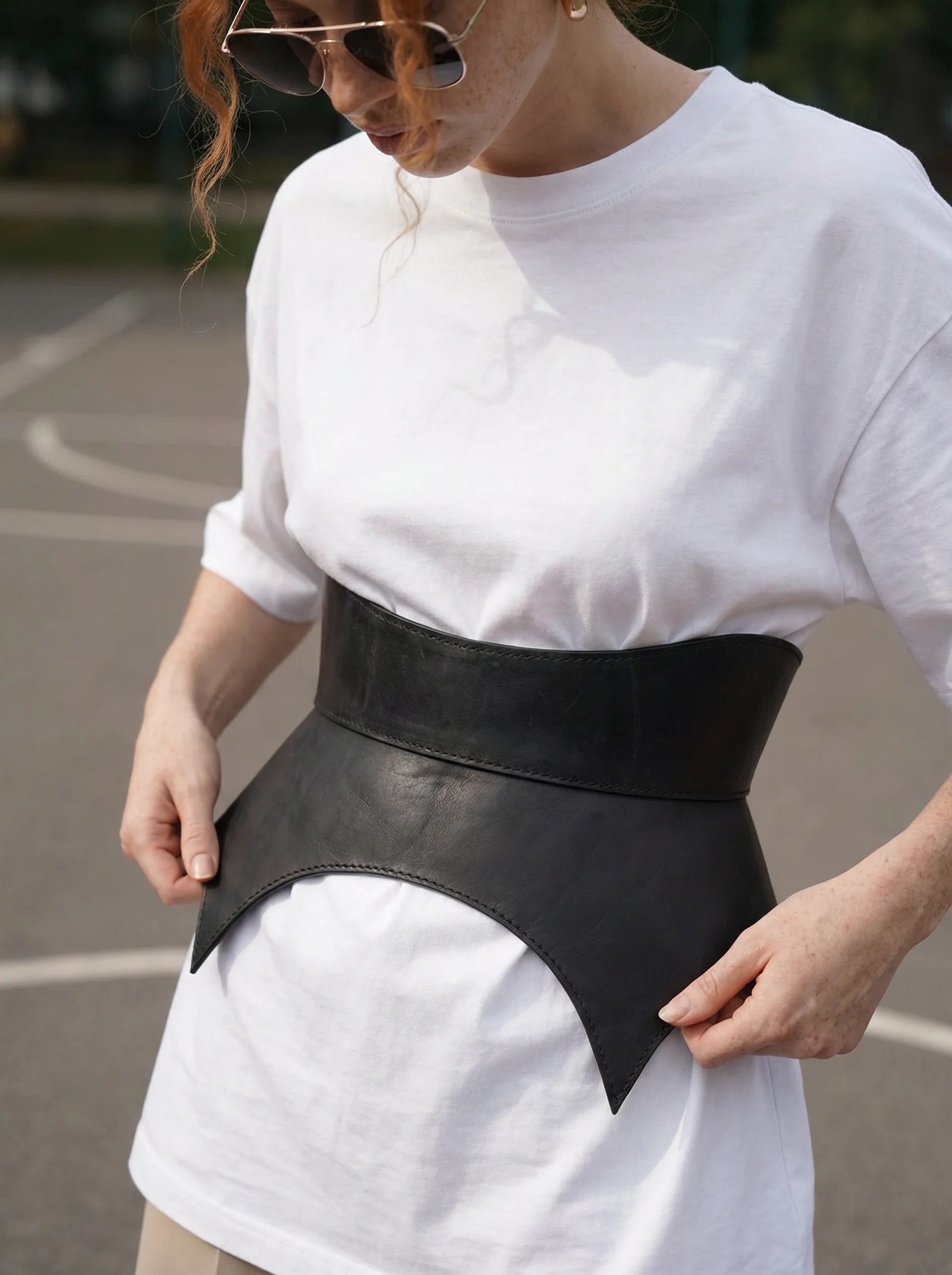 black leather basque belt cutout peplum waist belt structured waist belt sculpted leather belt statement outfit styling modern fashion waist belt
