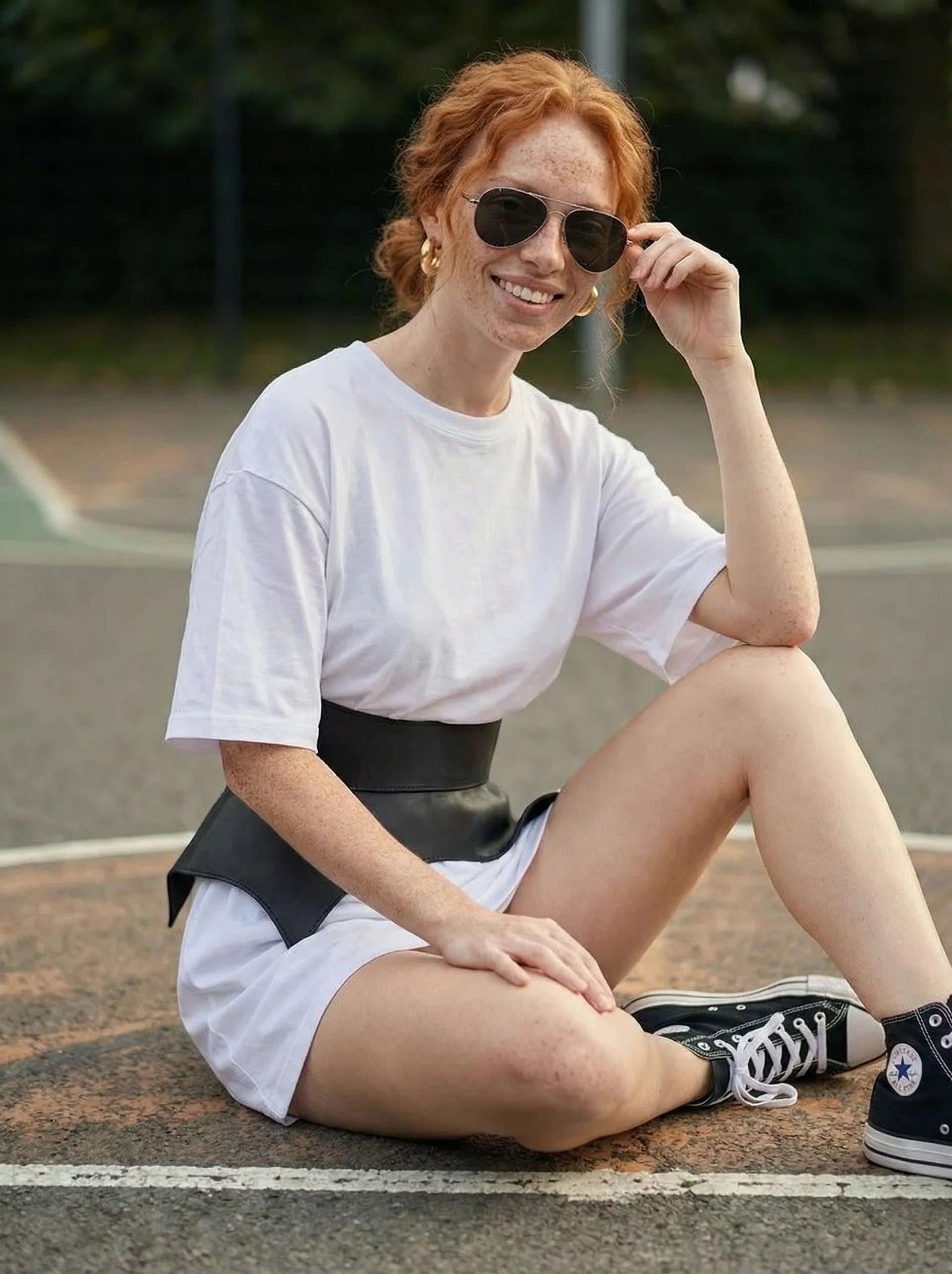 black leather basque belt cutout peplum waist belt structured waist belt sculpted leather belt statement outfit styling modern fashion waist belt