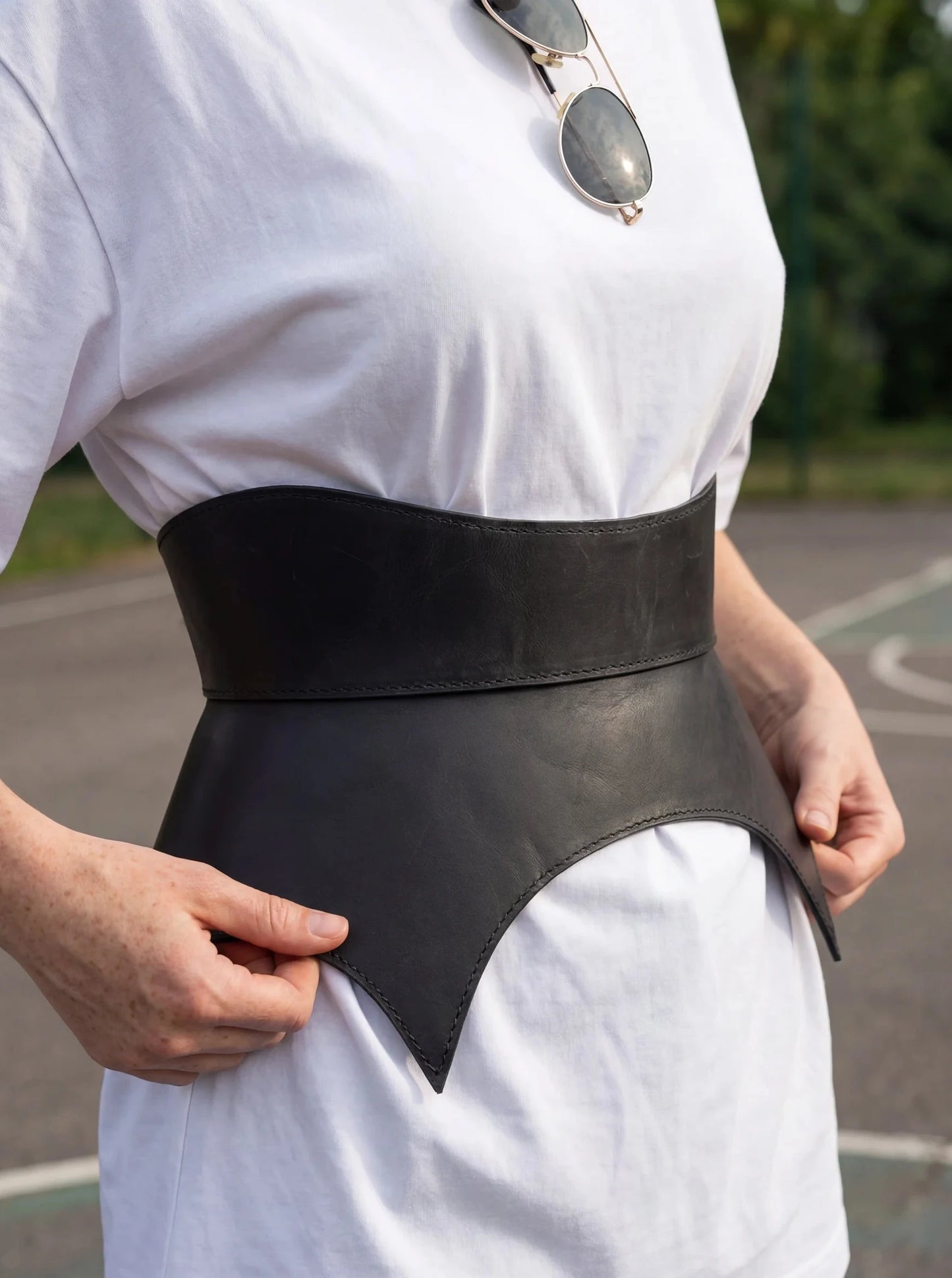 black leather basque belt cutout peplum waist belt structured waist belt sculpted leather belt statement outfit styling modern fashion waist belt