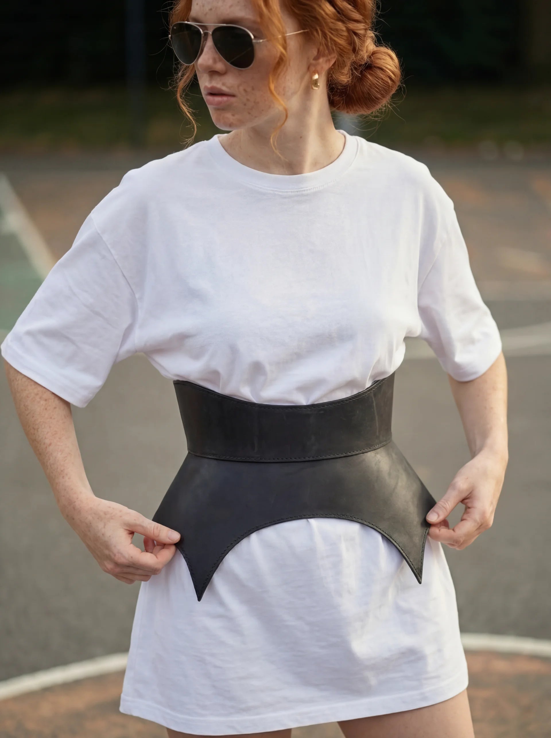 black leather basque belt cutout peplum waist belt structured waist belt sculpted leather belt statement outfit styling modern fashion waist belt