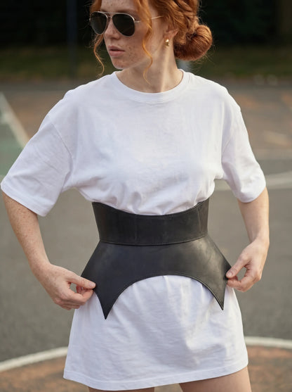 black leather basque belt cutout peplum waist belt structured waist belt sculpted leather belt statement outfit styling modern fashion waist belt