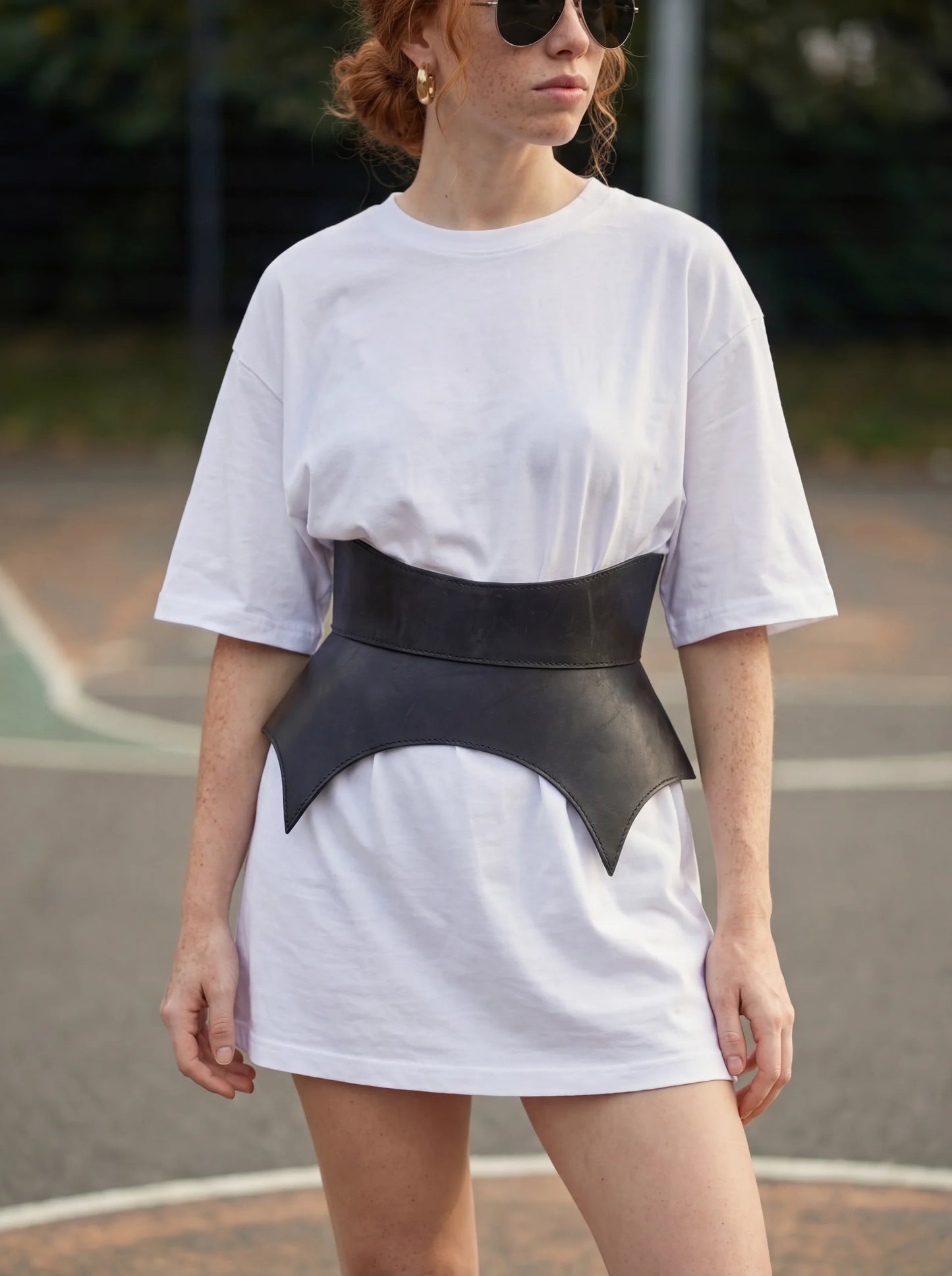 black leather basque belt cutout peplum waist belt structured waist belt sculpted leather belt statement outfit styling modern fashion waist belt