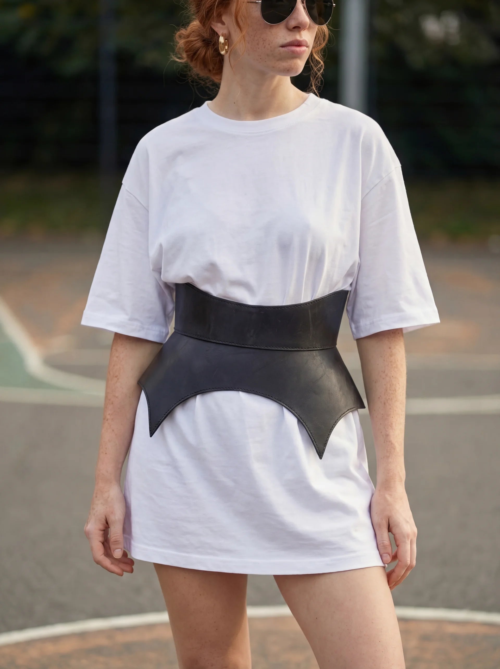 black leather basque belt cutout peplum waist belt structured waist belt sculpted leather belt statement outfit styling modern fashion waist belt