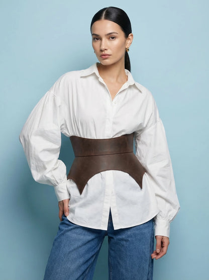 brown leather basque belt cutout peplum waist belt structured waist belt sculpted leather belt fashion waist belt modern outfit styling statement belt
