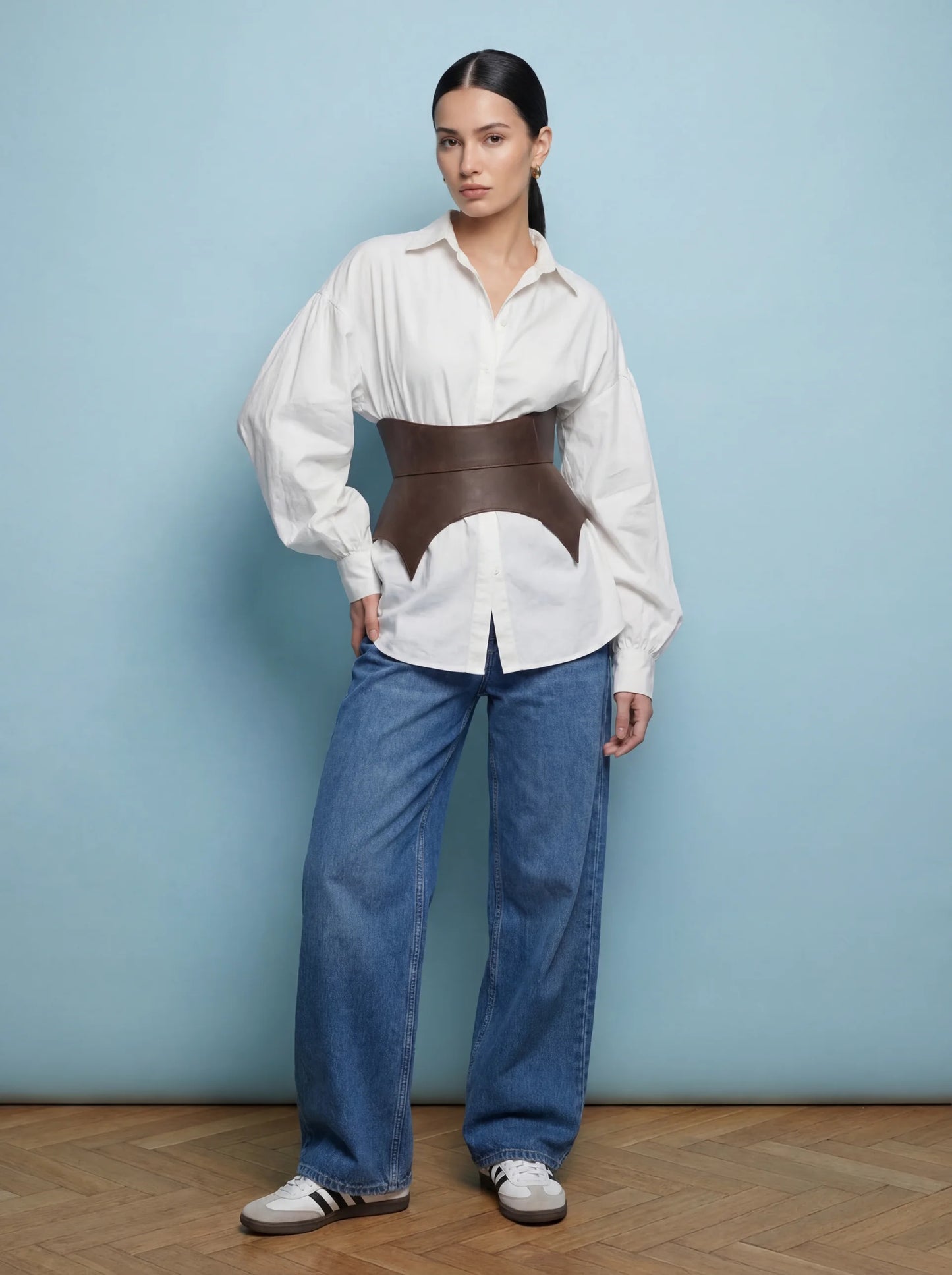 brown leather basque belt cutout peplum waist belt structured waist belt sculpted leather belt fashion waist belt modern outfit styling statement belt
