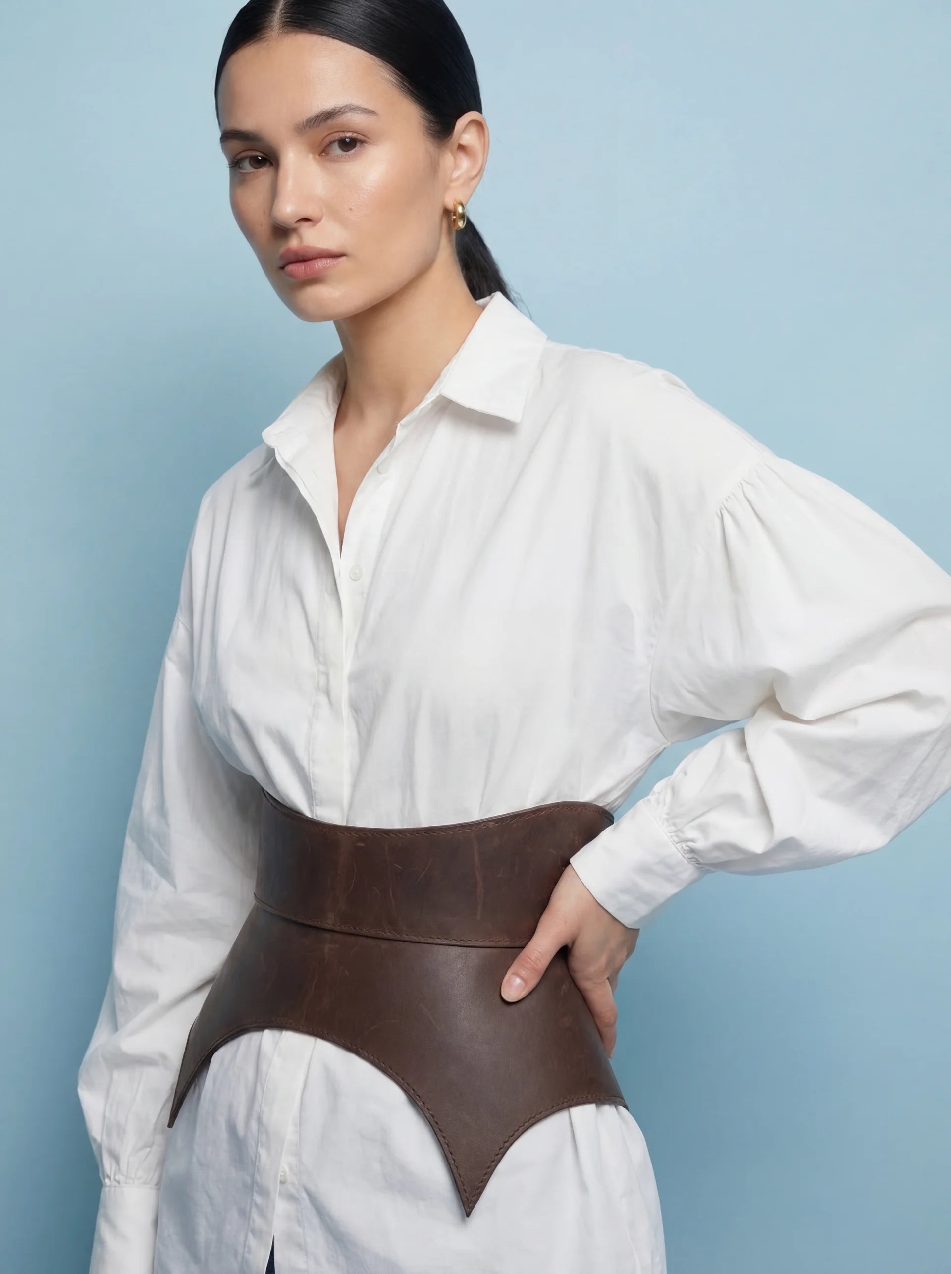 brown leather peplum belt cutout basque waist belt structured waist cincher style leather belt minimalist outfit styling modern fashion look