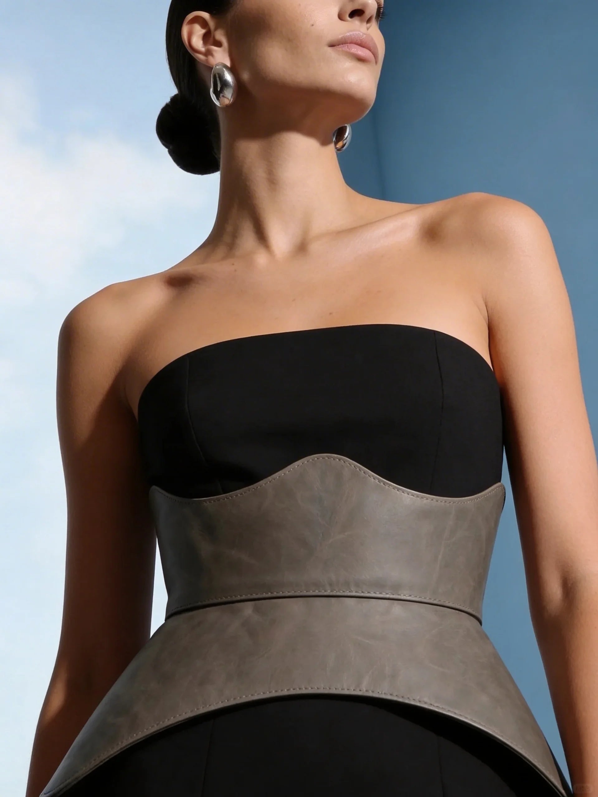 cool grey leather corset belt peplum basque waist cincher modern minimalist outfit styling structured waist belt elegant fashion look neutral aesthetic
