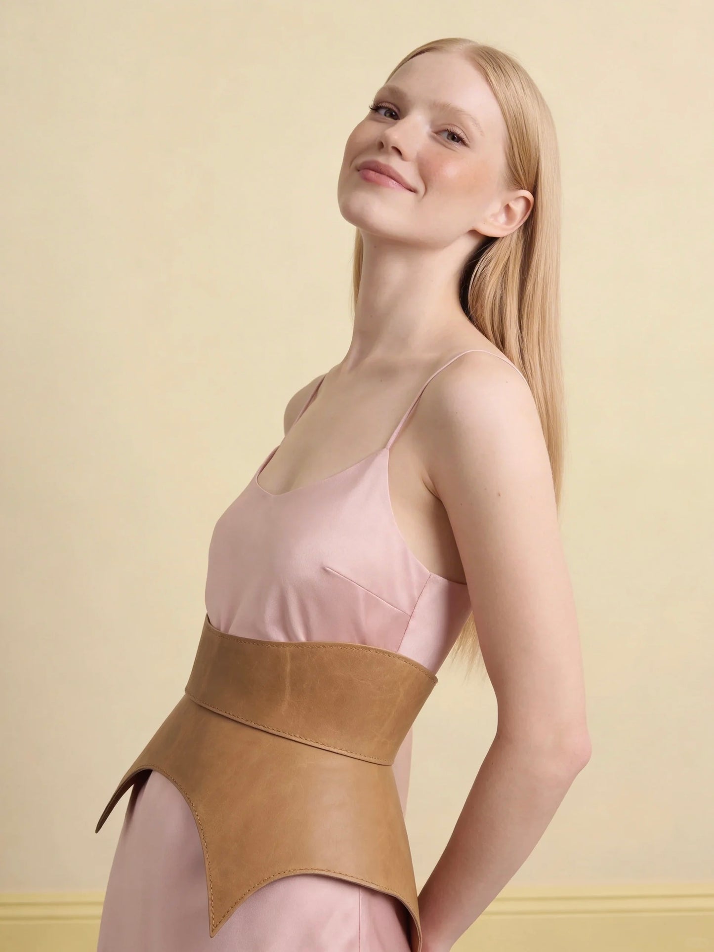 beige leather basque belt cutout peplum waist belt structured waist belt neutral leather belt minimalist outfit styling statement waist belt modern fashion