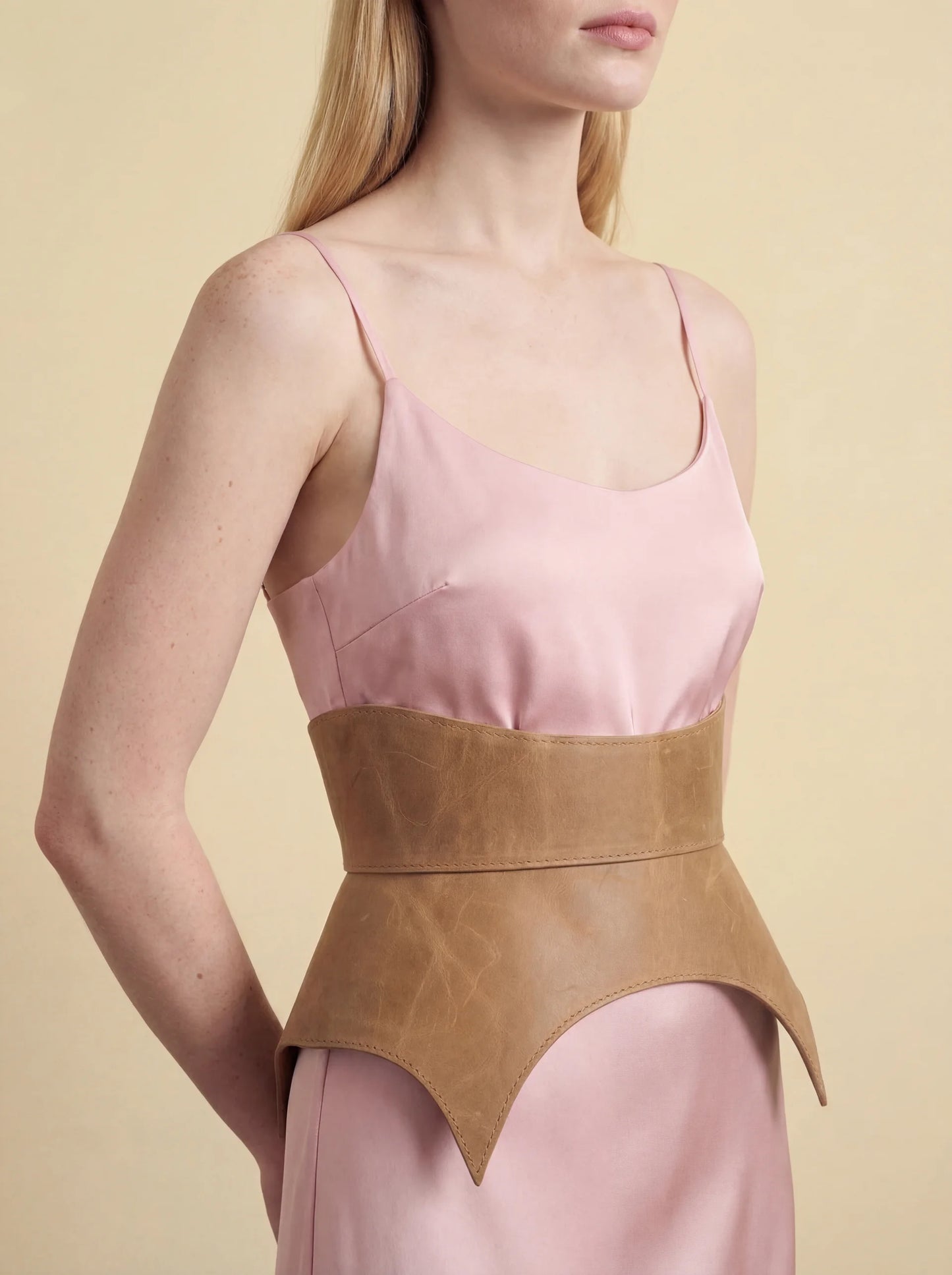 beige leather basque belt cutout peplum waist belt structured waist belt neutral leather belt minimalist outfit styling statement waist belt modern fashion