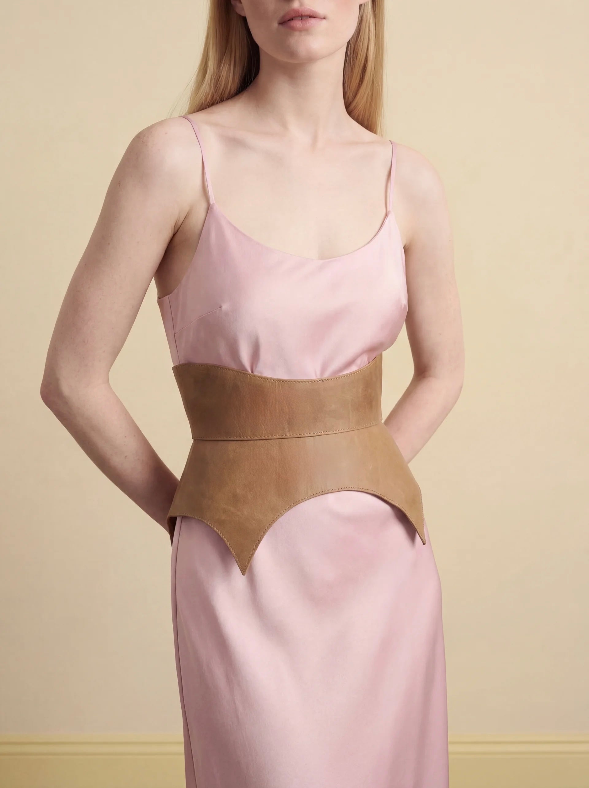 beige leather basque belt cutout peplum waist belt structured waist belt neutral leather belt minimalist outfit styling statement waist belt modern fashion