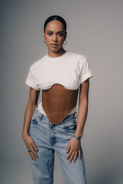 Beige long leather underbust corset belt styled with jeans