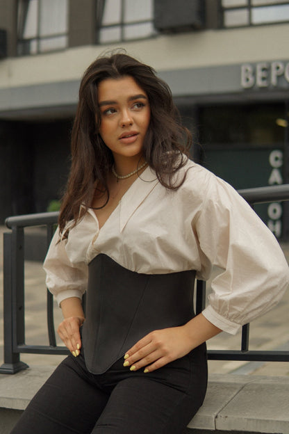 Black long leather underbust corset belt styled over white blouse
