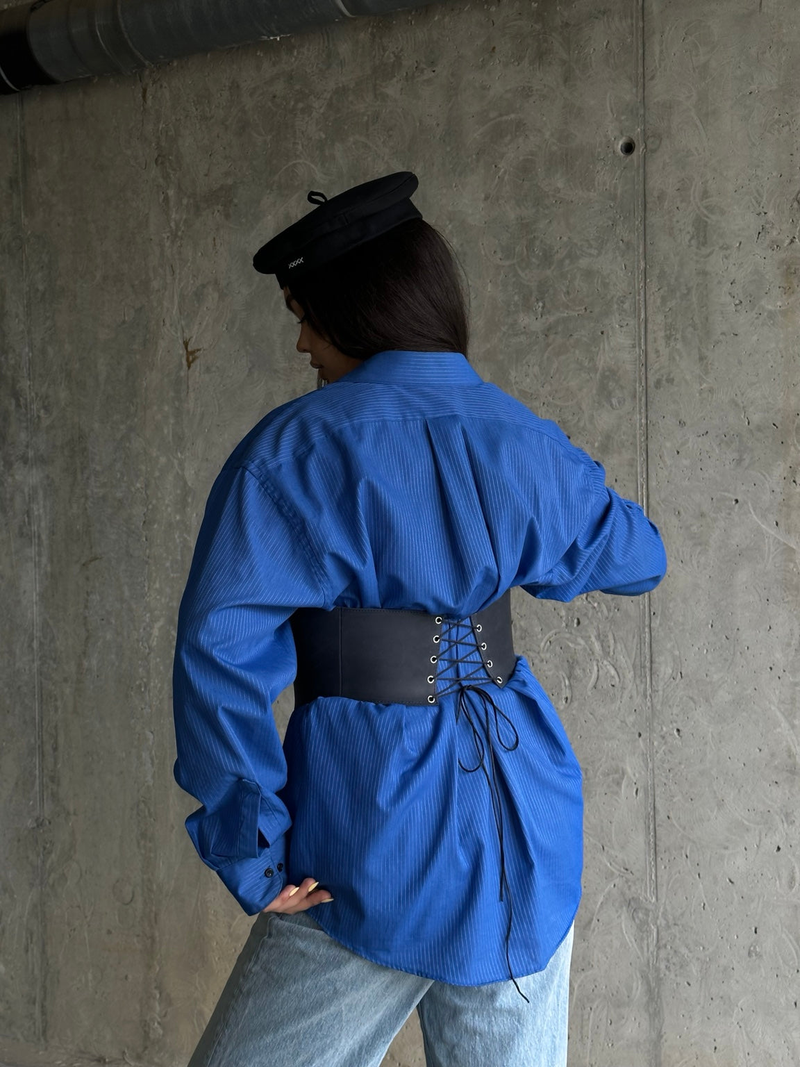 Back view of blue long leather underbust corset belt with lacing