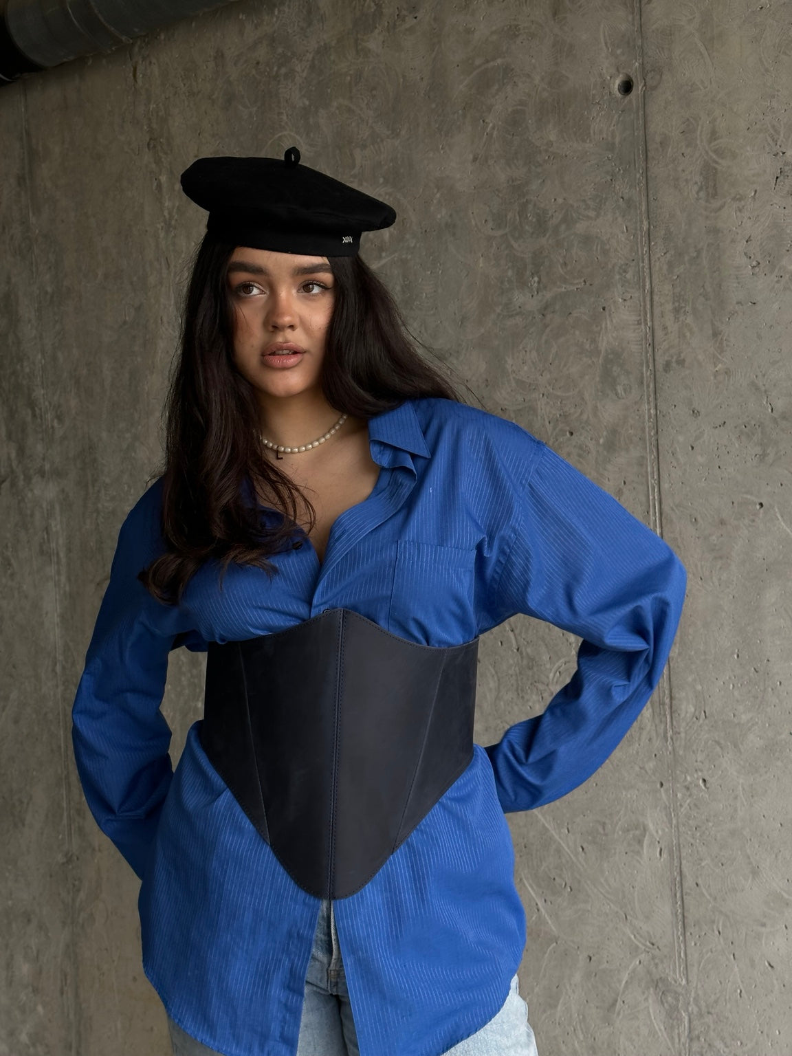 Close front view of blue long leather underbust corset belt