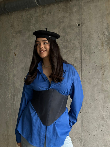 Blue long leather underbust corset belt smiling model look
