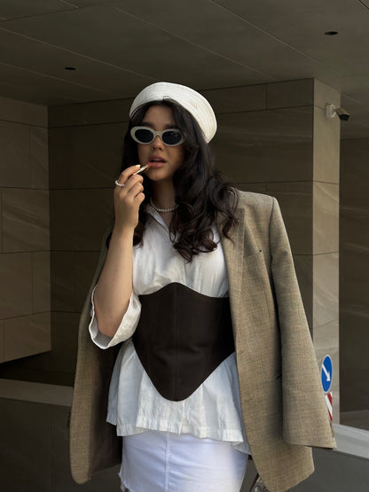 Brown long leather underbust corset belt styled with white shirt and blazer