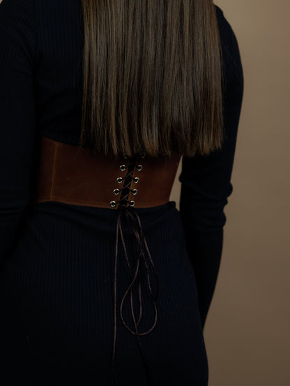 Back view of cognac long leather underbust corset belt with lacing