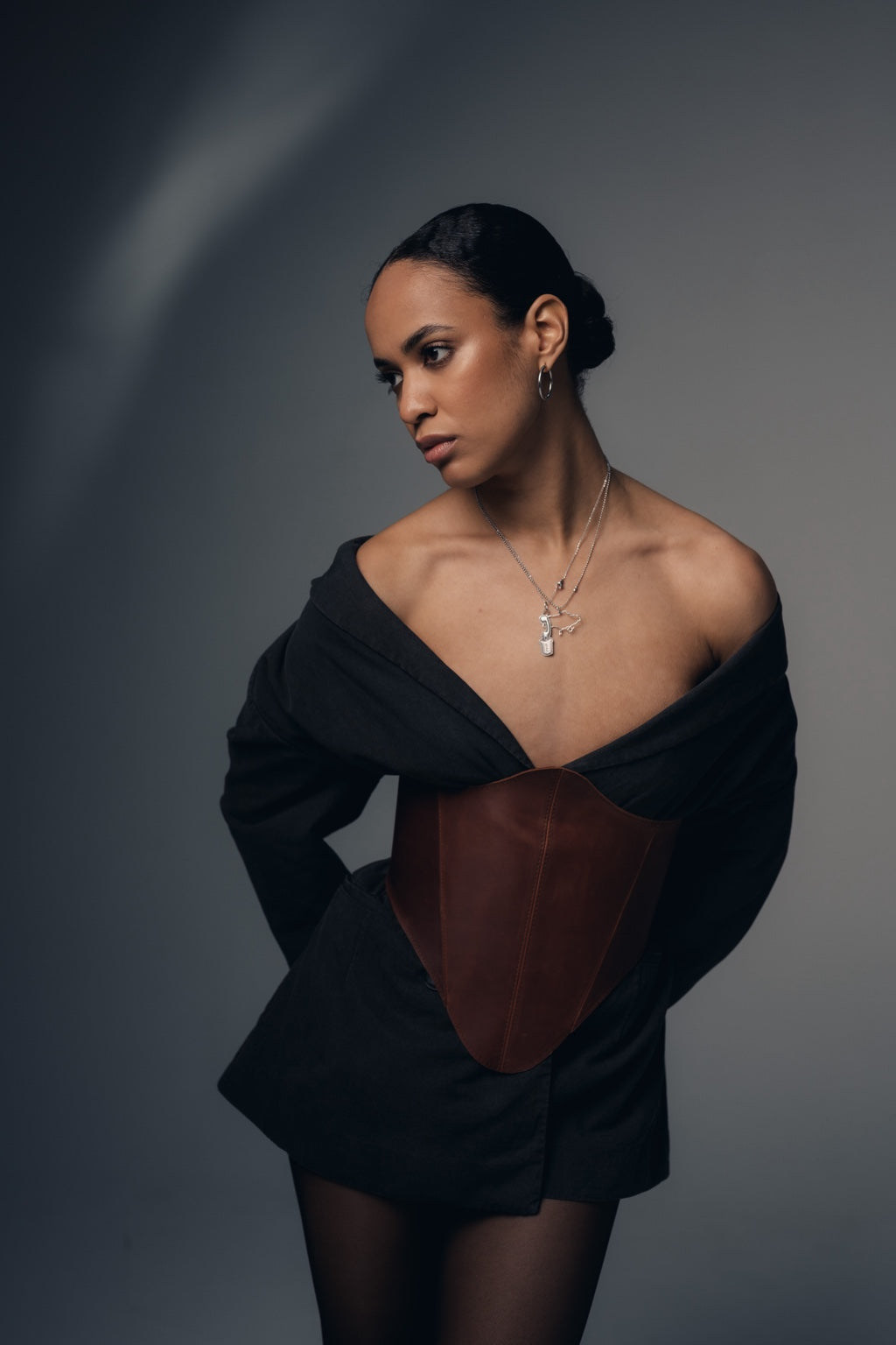 Portrait styling with cognac long leather underbust corset belt