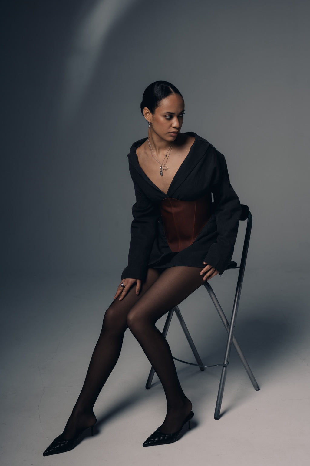 Seated styling with cognac long leather underbust corset belt