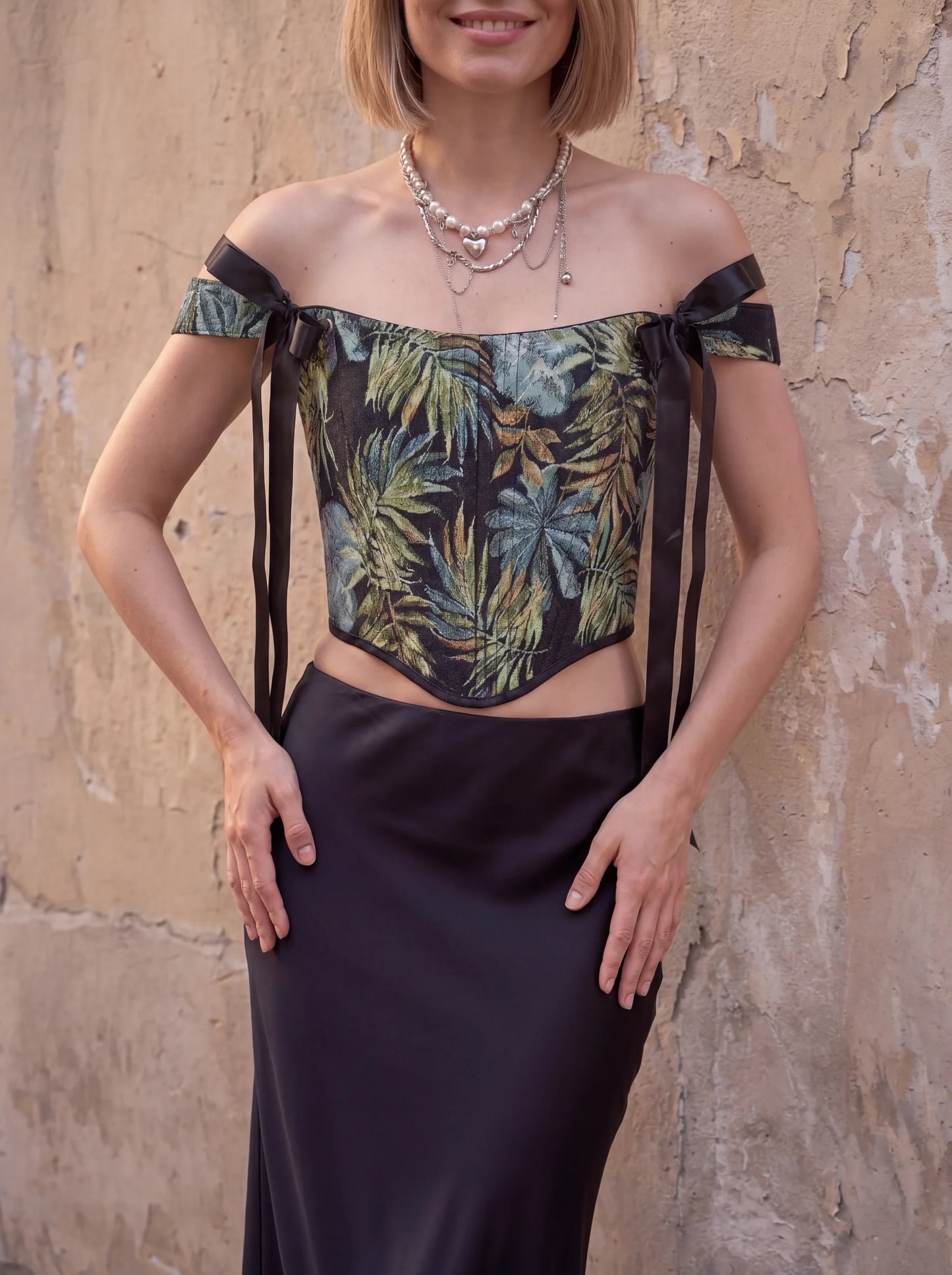 Dark tropical jacquard corset top front close up with black ribbons
