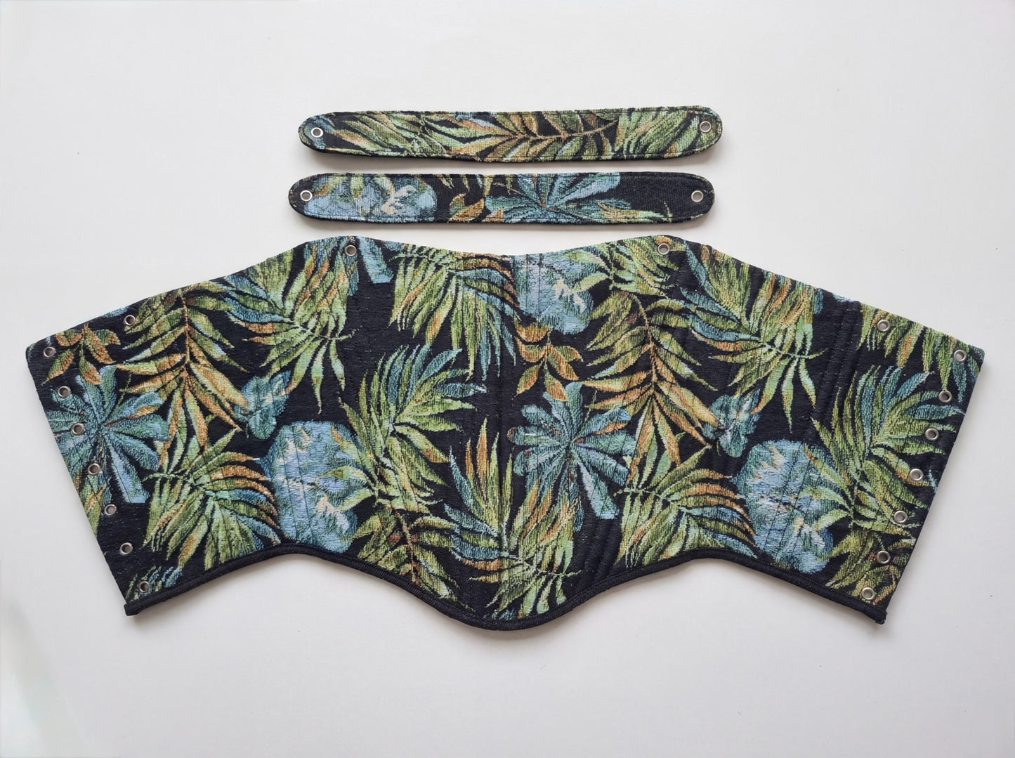 Dark tropical jacquard reversible corset top with black ribbon ties on white background