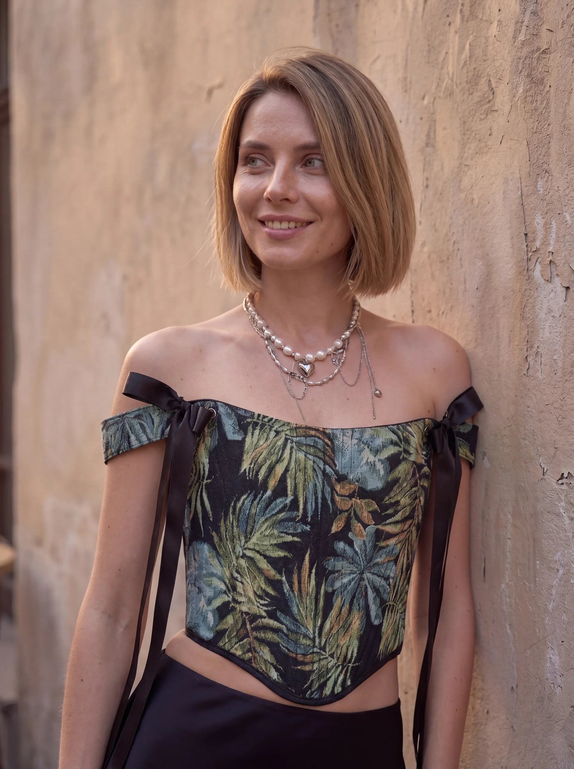 Dark tropical jacquard corset top portrait detail with black ribbon straps