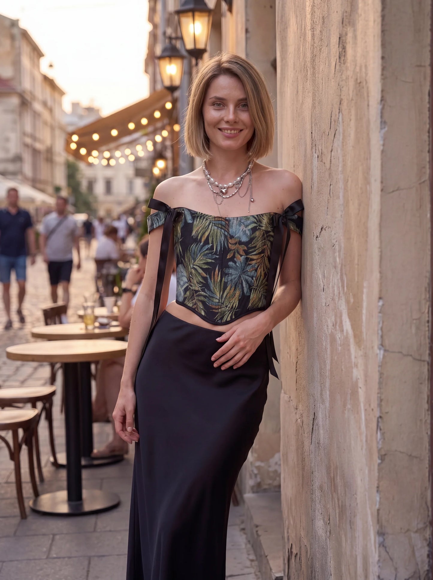 Dark tropical jacquard corset top styled in evening street look