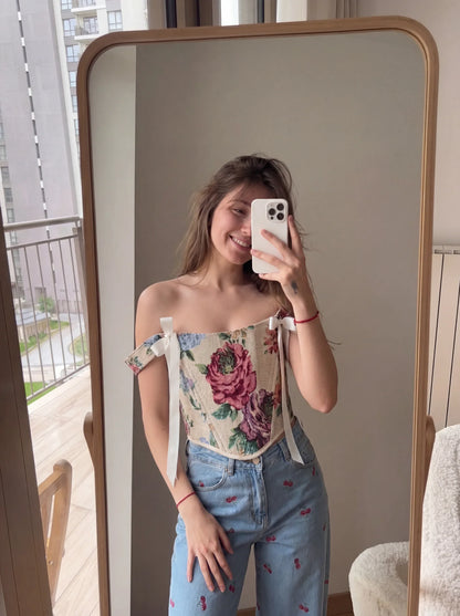Floral jacquard reversible corset top styled with denim