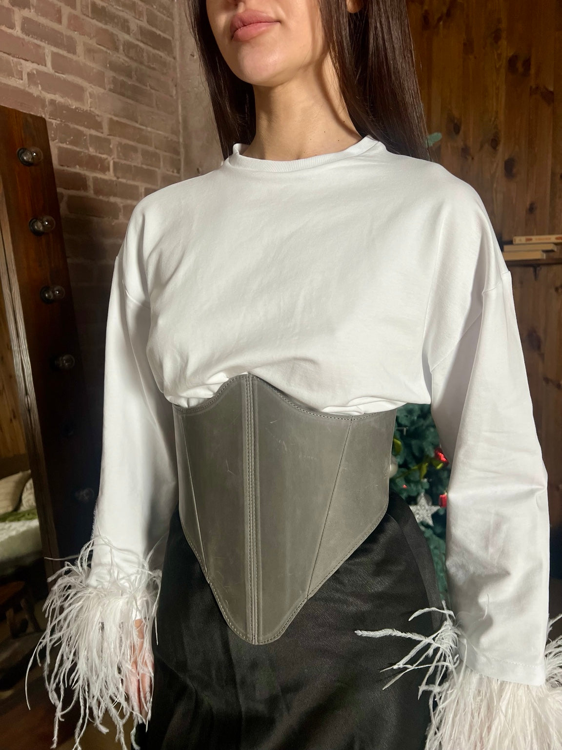 Close-up gray long leather underbust corset styled with white top
