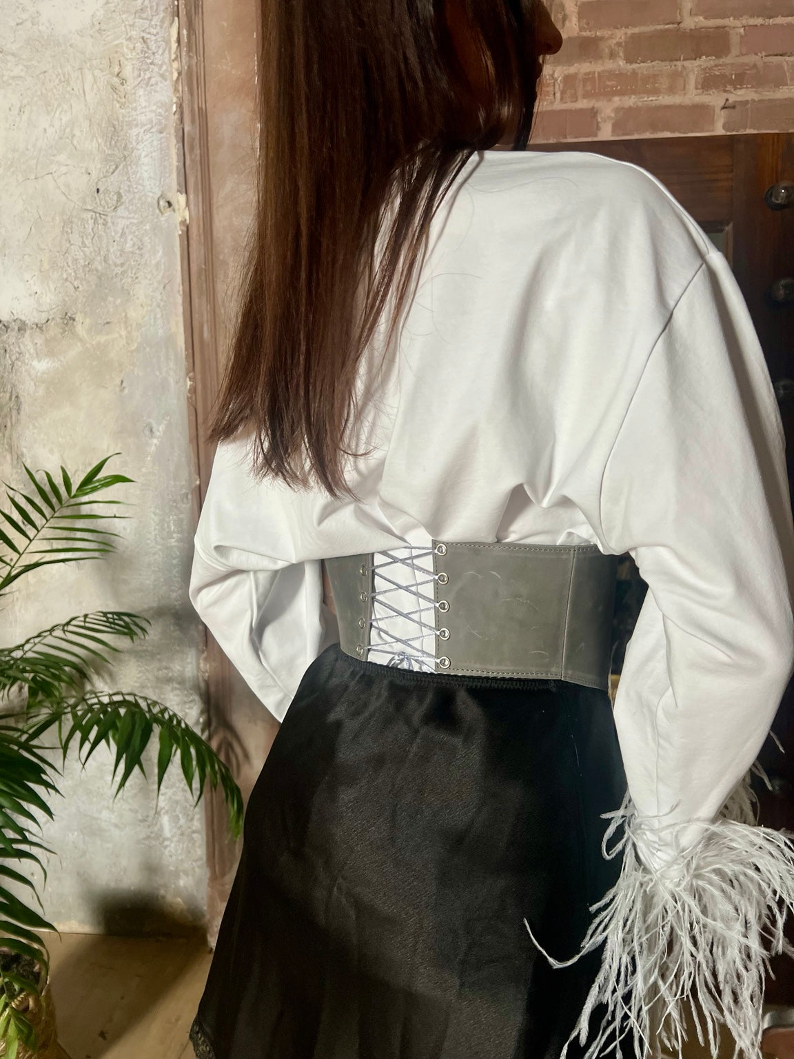 Back lacing detail of gray long leather underbust corset