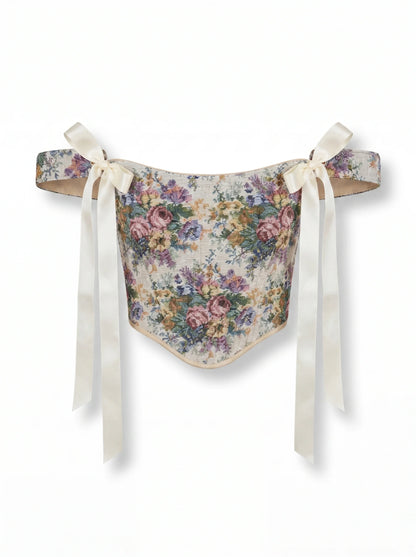 Pastel floral jacquard reversible corset top with cream ribbon ties on white background