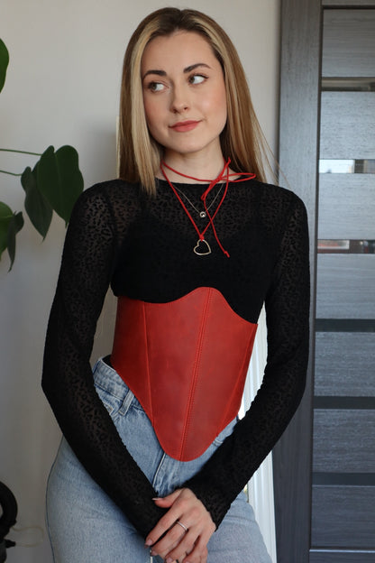 Close front styling with red long leather underbust corset belt